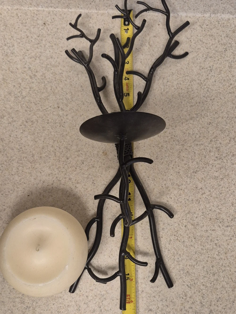 Wall-Mounted Brown Metal Branch Sconce with Cream Candle Holder. Its 17